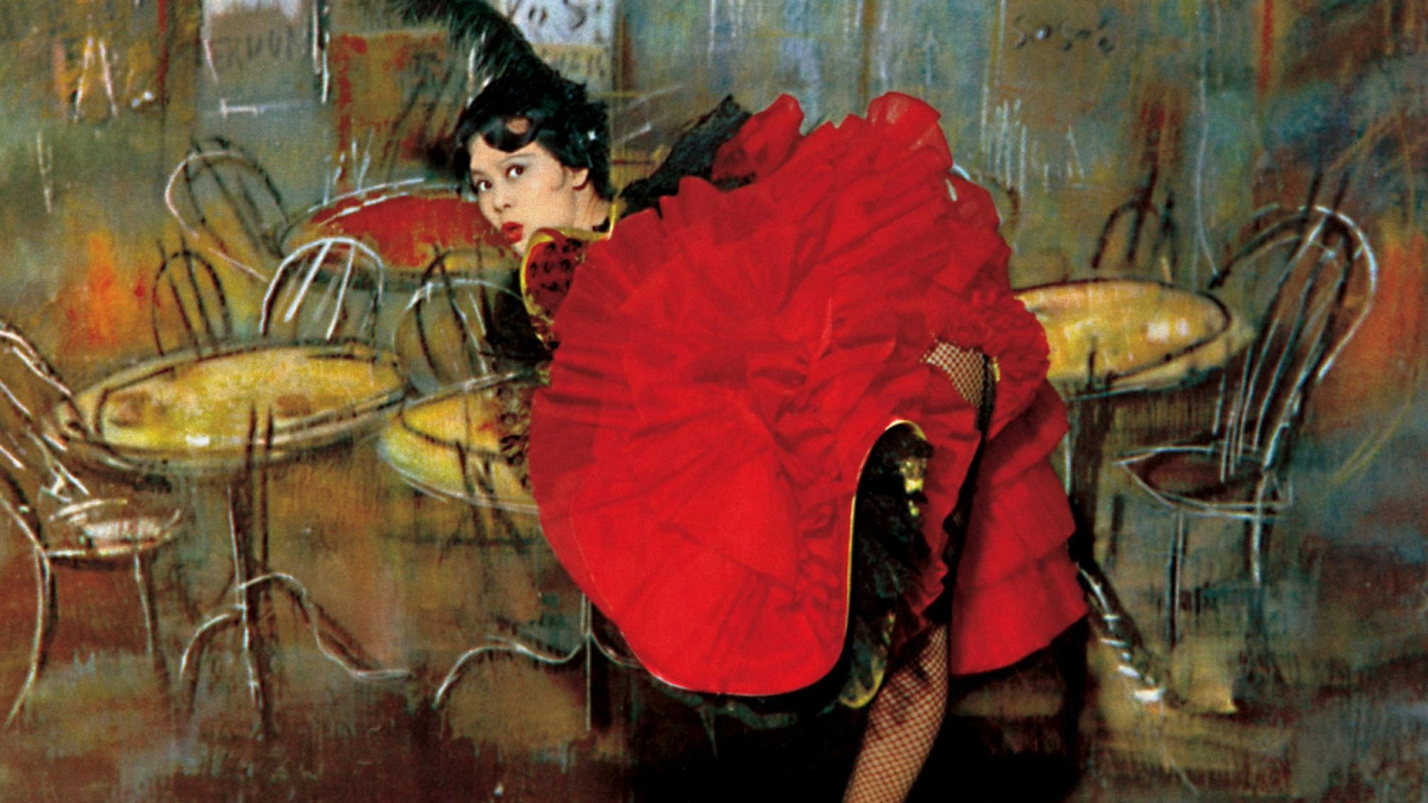 Linda Lin Dai dressed like a Moulin Rouge dancer in front of a theatrical backdrop.